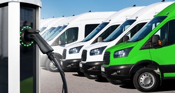 electric vehicle fleet with EV charging station in the foreground